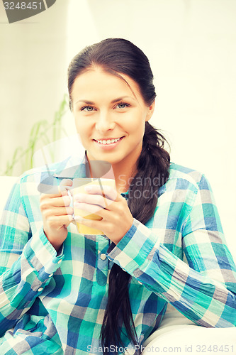 Image of lovely housewife with mug