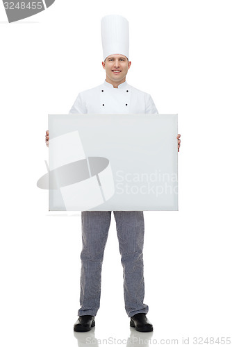 Image of happy male chef cook holding white blank big board