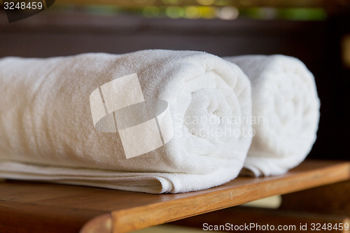 Image of rolled bath towels at hotel spa