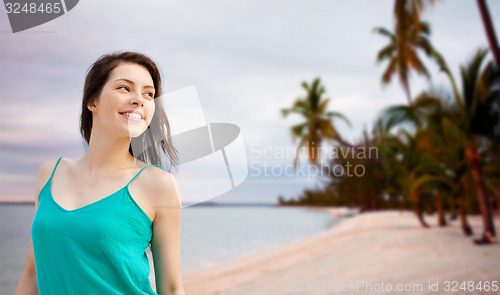 Image of happy girl or young woman looking aside