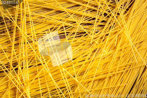 Image of italian spaghetti on wooden background