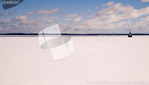 Image of Frozen Lake Michigan Solid Ice Blue Sky Nautical Beacon