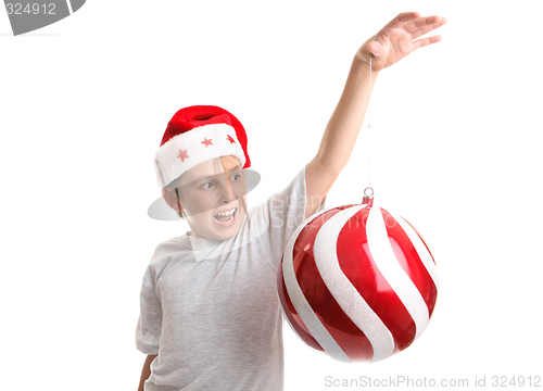 Image of Boy with an oversized Chirstmas Bauble
