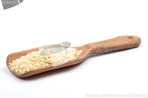 Image of Millet flakes on shovel