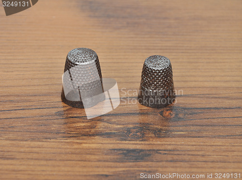 Image of Thimble on wood