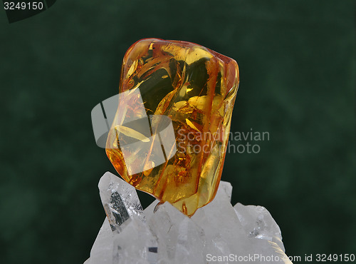 Image of Amber on rock crystal