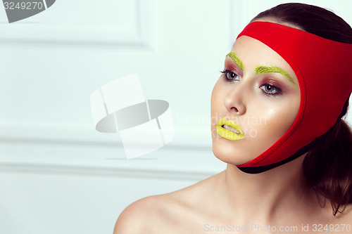 Image of closeup portrait of beautiful young woman with creative makeup 
