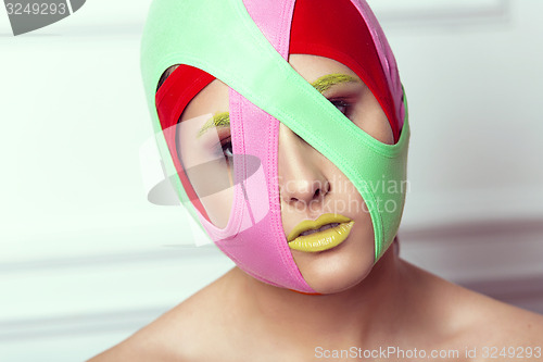 Image of closeup portrait of beautiful young woman with creative makeup 