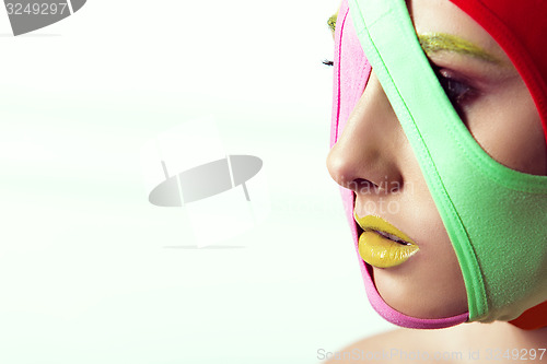 Image of closeup portrait of beautiful young woman with creative makeup 