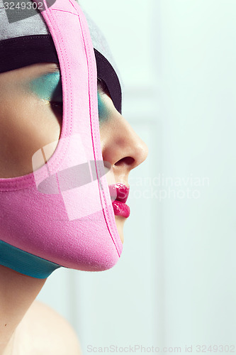 Image of closeup portrait of beautiful young woman with creative makeup 