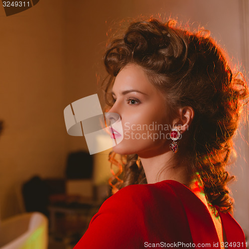 Image of beautiful blonde woman with red lips and curly hairs