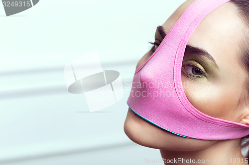Image of closeup portrait of beautiful young woman with creative makeup 