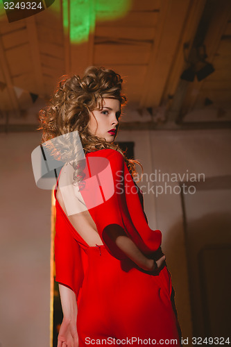 Image of beautiful blonde woman with red lips and curly hairs