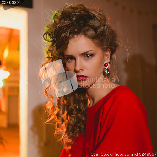 Image of beautiful blonde woman with red lips and curly hairs