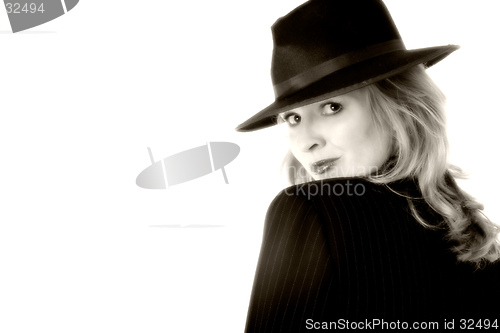 Image of Lady in black suit and hat