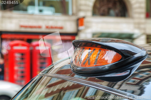 Image of Famous black cab on a street in London