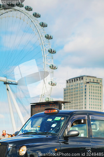 Image of Famous black cab an a street in London