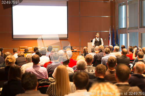 Image of Speaker at Business Conference and Presentation.