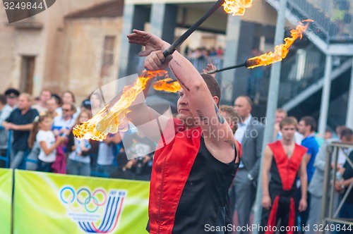 Image of Dance with fire or fire show in the program Youth meeting in boxing match between teams of Russia and Cuba