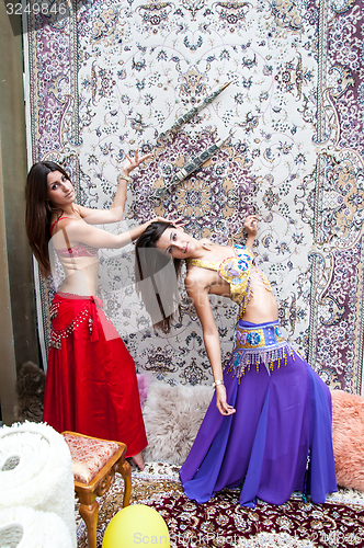 Image of Girl on background of carpet Arab style