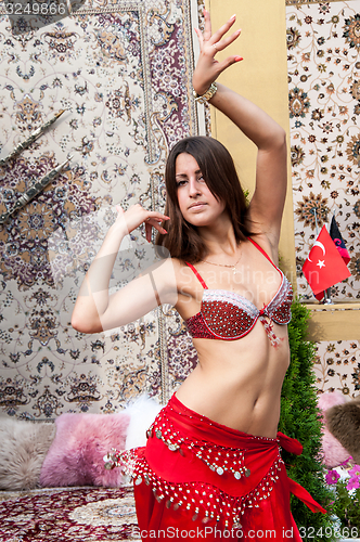 Image of Girl on background of carpet Arab style