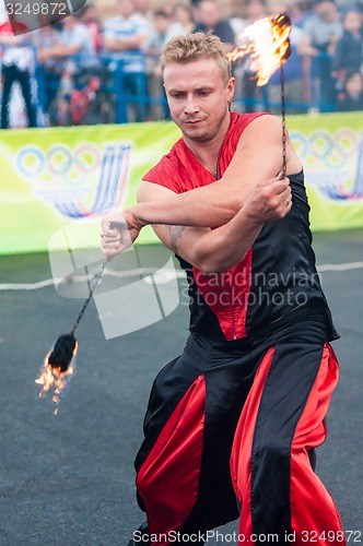 Image of Dance with fire or fire show in the program Youth meeting in boxing match between teams of Russia and Cuba