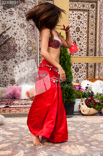 Image of Girl on background of carpet Arab style