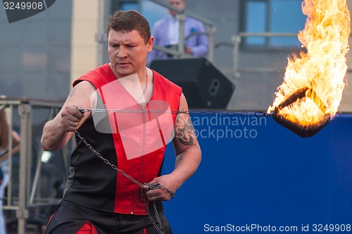 Image of Dance with fire or fire show in the program Youth meeting in boxing match between teams of Russia and Cuba