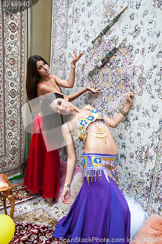 Image of Girl on background of carpet Arab style