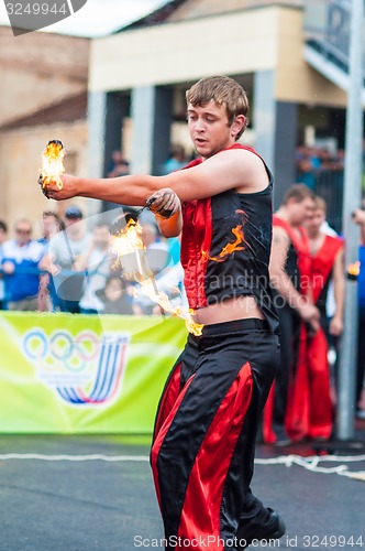 Image of Dance with fire or fire show in the program Youth meeting in boxing match between teams of Russia and Cuba