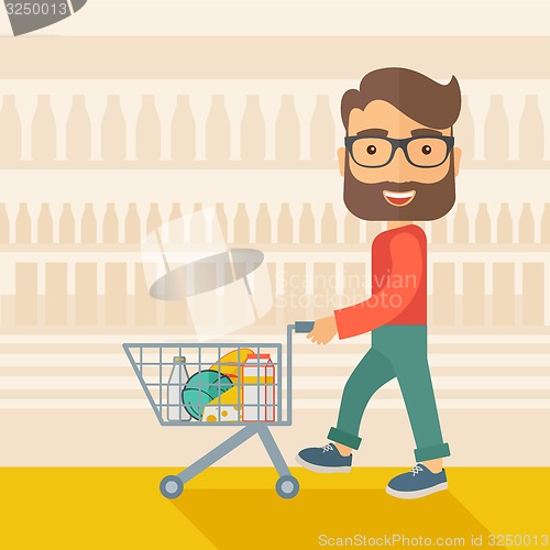 Image of Male Shopper Pushing a Shopping Cart.