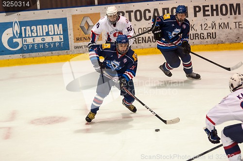 Image of Hockey with the puck, 