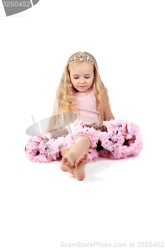 Image of Happy little girl in pink tutu skirt and diadem