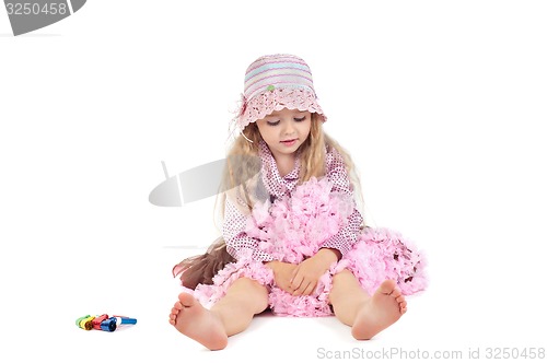 Image of Happy little baby girl in pink tutu skirt and hat