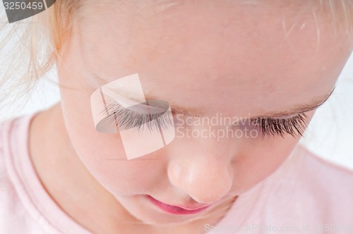 Image of Portrait of cute little girl with long eyelashes