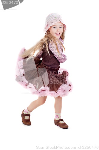 Image of Dancing happy little girl in pink tutu skirt