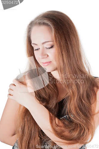 Image of Pretty woman hair holding her shoulder