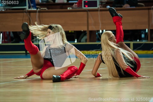 Image of Girl Cheerleading appear on stage Match of the womens League of the Championship of Russia on basketball Nadezhda (Orenburg)-Dinamo GUVD (Novosibirsk)