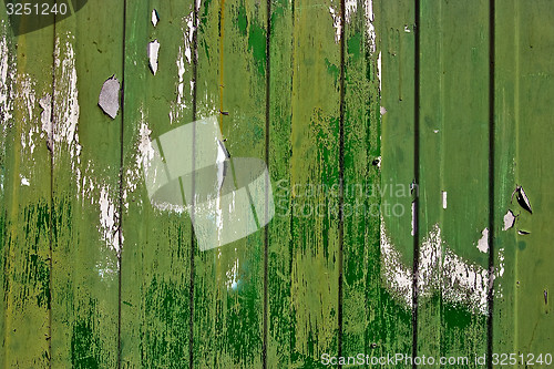 Image of Dirty, stained by a paint the hammered together fence