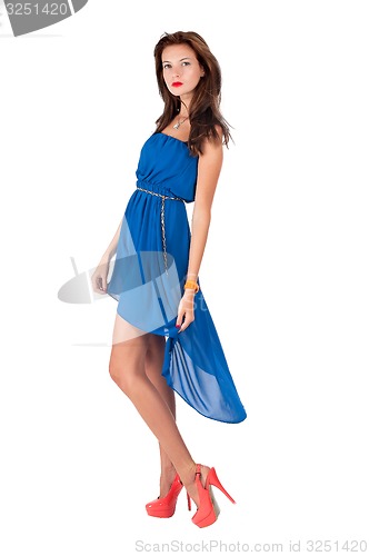 Image of Beautiful young red haired woman in blue dress