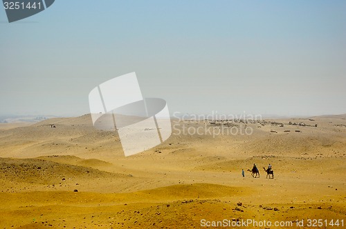 Image of Bedouins with camels on Desert in Africa