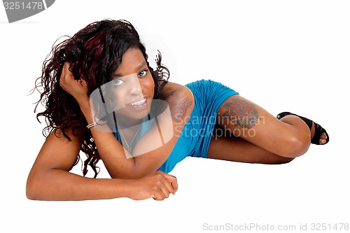 Image of Black woman lying on floor.