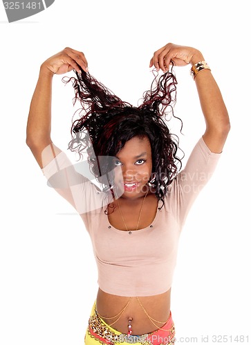 Image of African woman pulling her hair.