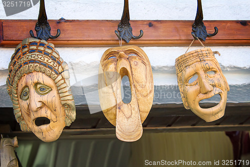 Image of Souvenirs : masks made of wood, symbolizing human emotions.