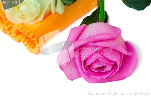 Image of Bouquet of roses in a beautiful package on a white background.