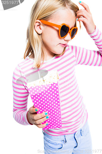 Image of Girl eating pop corn