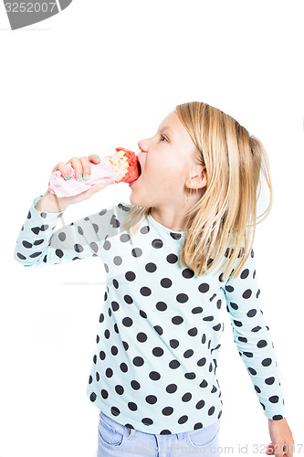 Image of Girl eating strawberry ice cream