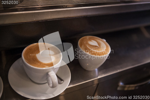 Image of Delicious coffee cups with hearts