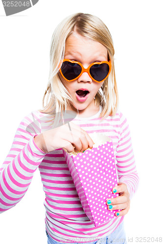 Image of Girl eating pop corn