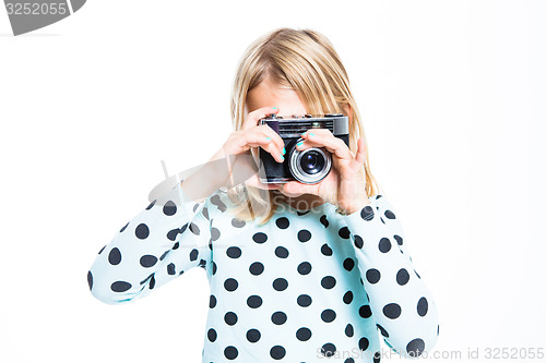 Image of Girl with an old camera